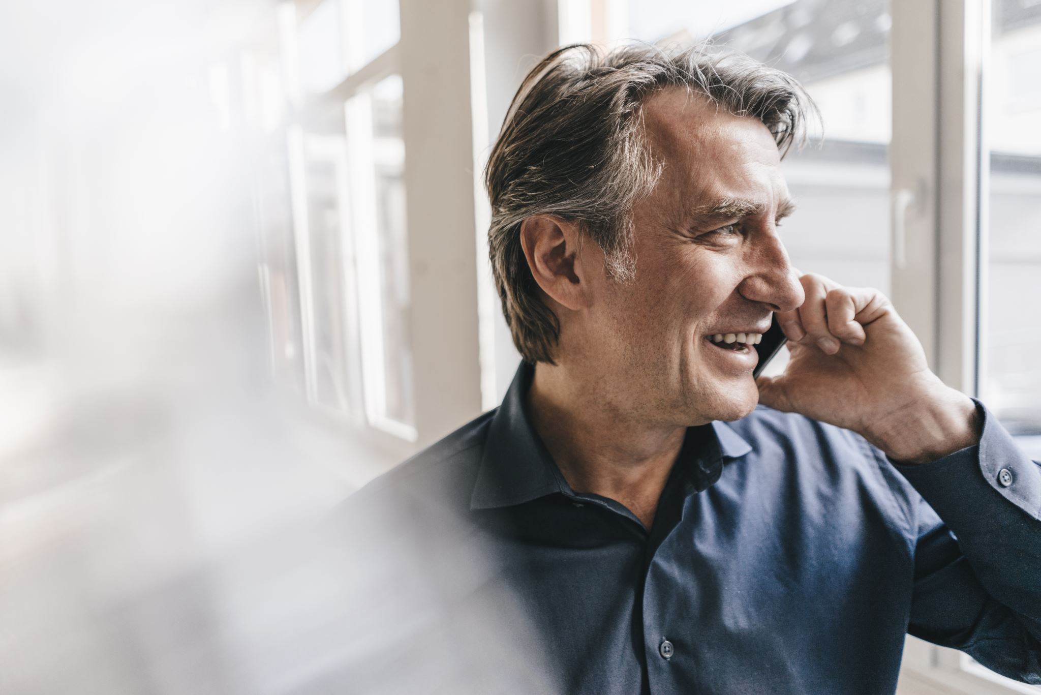 Smiling-man-talking-on-cell-phone